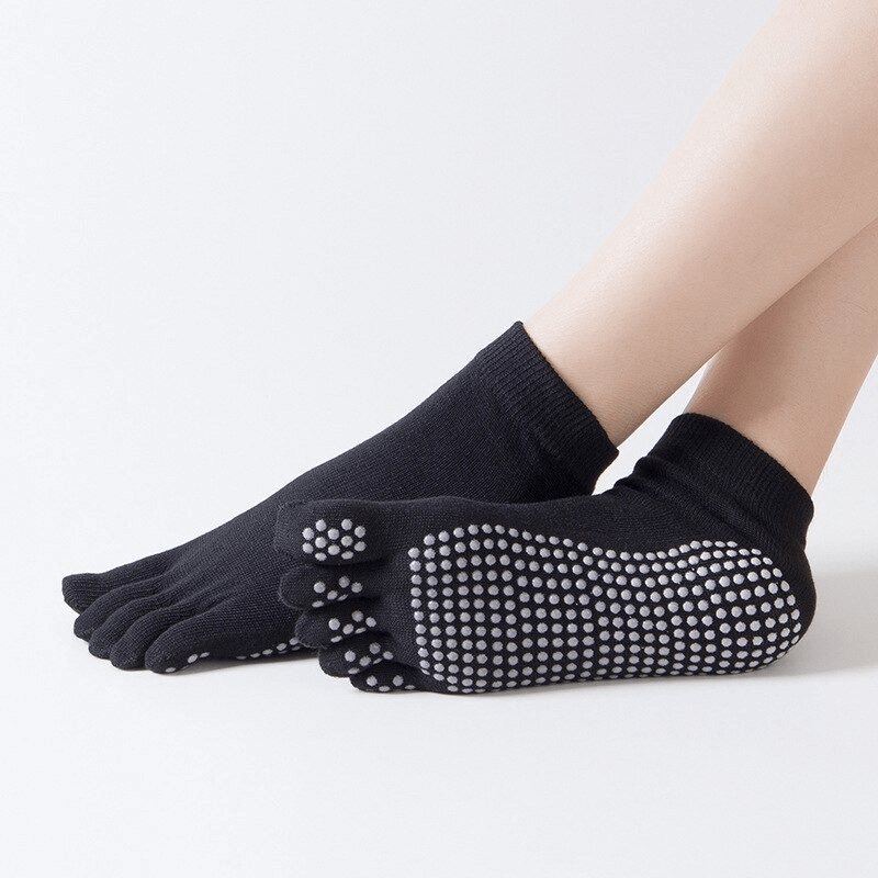Black non-slip quick-drying women's five-toe socks with grips for yoga and sports.